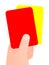 Hand holding red and yellow card