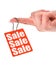 Hand holding sale tag