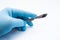 Hand holding scalpel. Palm of surgeon dressed in blue glove holding scalpel. Concept photo for surgeries, procedures, treatment, p