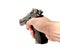 A hand holding a semi automat gun pointing forward