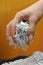 Hand holding shredded paper 2