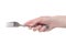 Hand holding a silver fork on an isolated white background