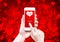 Hand holding smart phone with sending love word and heart shape