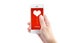 Hand holding smartphone with sending word and heart shape on scr