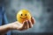 hand holding a smiling ball. Improve Business Value: Customer Reviews Shape Service Experience & Product Quality. Feedback Matters