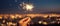 Hand Holding Sparkler Captures Vibrant Night View of City