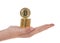 Hand holding stacked bitcoins one balancing on top sideways