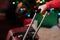 Hand holding a suitcase luggage shallow depth of field, colorful lights on a background