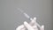 Hand holding syringe coronavirus