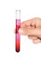 Hand holding a test tube with the reagent