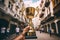 hand holding a trophy in front of a building