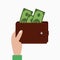 Hand holding wallet with money, purse with banknotes. Vector.