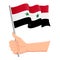 Hand holding and waving the national flag of Syria. Fans, independence day, patriotic concept. Vector illustration