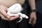 Hand holding white baby python