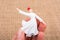 Hand holding a white color Sufi Dervish figurine