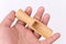 Hand holding wooden measuring spoon