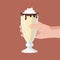 Hand holds a Creamy milkshake
