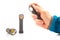 hand holds a flashlight against the background of other flashlights on a white background. camping and household item