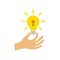 Hand holds a light bulb with a keyhole. Business idea concept