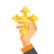 Hand holds the Orthodox gold cross. Concept of religion, Christianity.