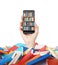 A hand holds a smartphone with a book shelf on the screen. A heap of colourful books. A concept of education and technology. isola