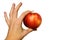 Hand hols an apple