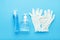 Hand hygiene, rubber gloves, different bottles of hand sanitizers, antiseptic gel. Virus protection, antibacterial gel, soap.