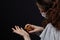 Hand hygiene for viral infections, young girl in an antiviral medical respiratory mask puts on her hands an antiviral, antiseptic