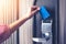 Hand inserting key card to unlock a door security authentication in the hotel or apartment safeguard