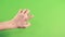 Hand isolated on green screen in studio. Gesture on background