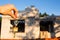 Hand with the key to the future house on the background of a construction site and walls made of porous concrete block. Building a