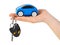 Hand with keys and car