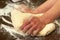 Hand knead dough on the wooden table