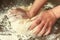 Hand knead dough on the wooden table