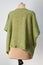 Hand-knitted coat in green color. spring seasonal clothing.