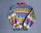 Hand-knitted striped women`s oversized sweater made of multicolored wool