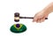 Hand knocking a Judge gavel at soundboard with Flag of Brazil
