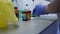 Hand of a laboratory technician in disposable gloves prepare a medical product