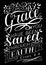 Hand lettering with bible verse For by grace you have been saved through faith on black background.