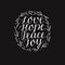 Hand lettering with inspirational holiday quotes Love, hope, peace, joy on black background.