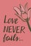 Hand lettering Love never fails with pink lily.