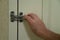 Hand locking lock on hotel door