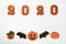 The hand-made eatable gingerbread 2020 inscription, Halloween pumpkins and bats