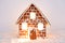 The hand-made eatable gingerbread house with light inside