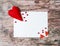 Hand made felt colorful hearts white paper on wooden background