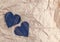 Hand made Jeans hearts on a crumpled craft paper background. Flat lay, top view, minimal style, copy space for text. Symbol of lov