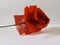 A hand made rose made from synthetic cloth