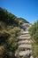 Hand made steps on a mountain hiking path for safety