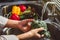 Hand of maid washing tomato fresh vegetables preparation healthy food in kitchen