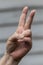 A Hand Making a Gesture of a peace sign